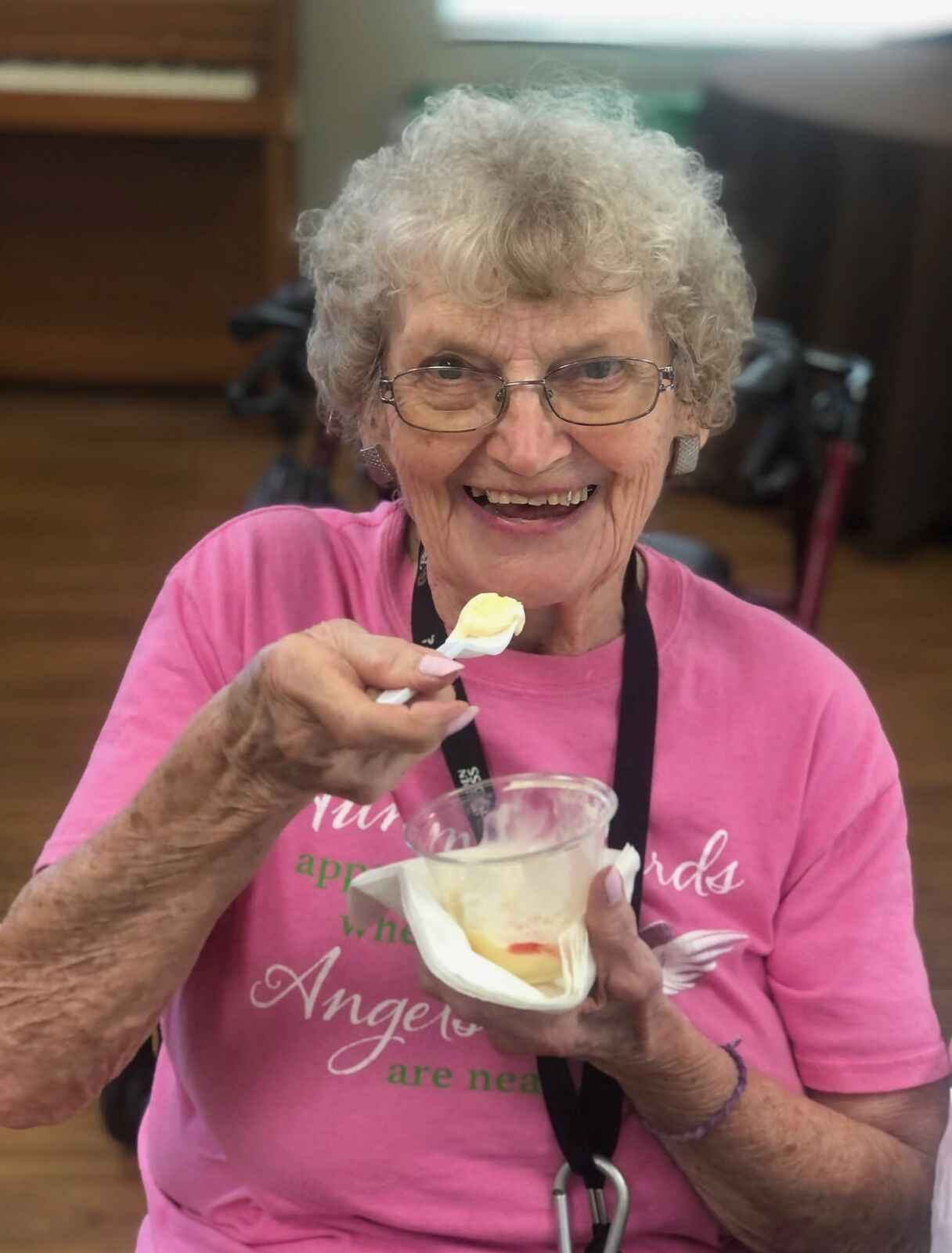 Golden Cross senior resident enjoying dessert at a community gathering
